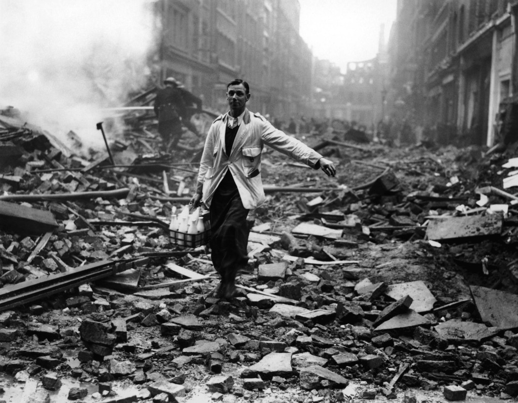 Milkman Fred Morley delivers milk in London despite the devastation of German bombing raids