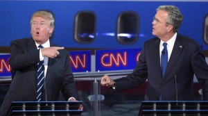 Republican presidential candidates, former Florida Gov. Jeb Bush, right, and Donald Trump both speak during the CNN Republican presidential debate at the Ronald Reagan Presidential Library and Museum on Wednesday, Sept. 16, 2015, in Simi Valley, Calif. (AP Photo/Mark J. Terrill)